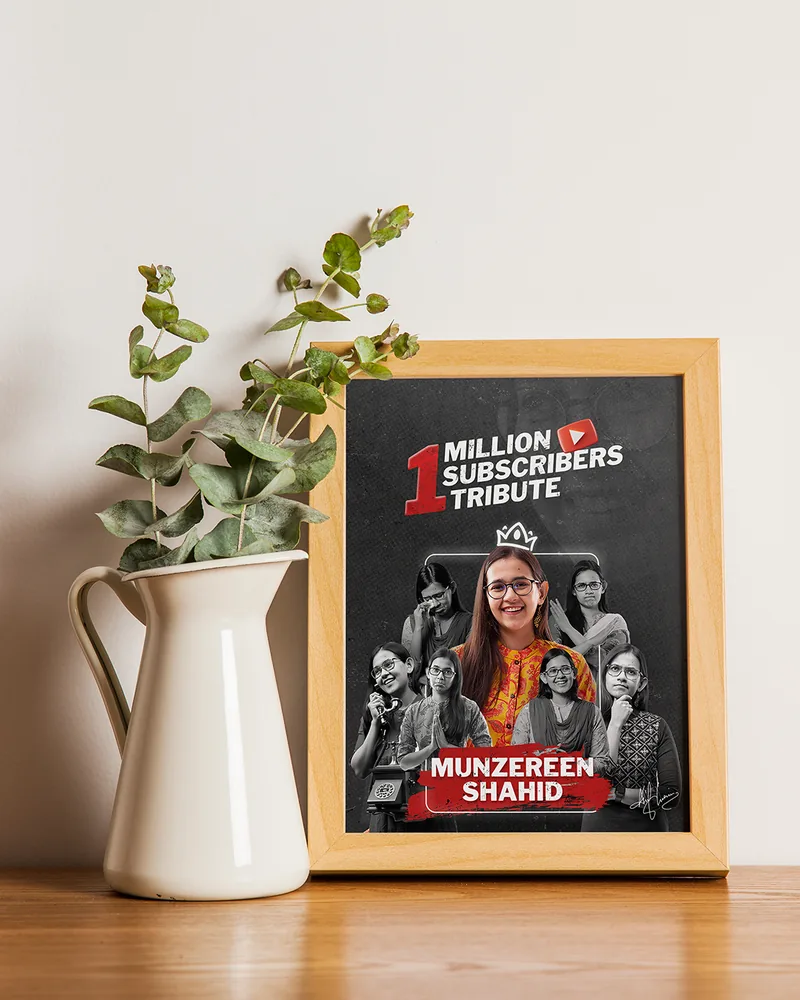 Framed poster mockup beside a vase