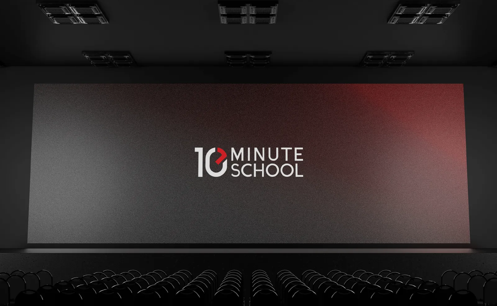 The logo on a cinema screen in a dark hall