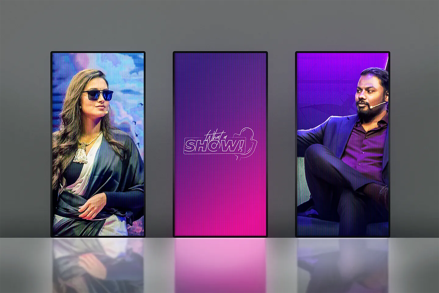 Three tall screens: two guests and the sign